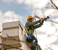 Lineman in bucket truck working